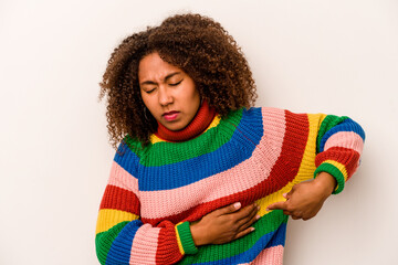 Young African American woman isolated on white background having a liver pain, stomach ache.