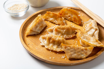 Close up of Fried oriental dumplings gyoza with meat food on plate