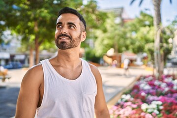 Hispanic sports man wearing workout style outdoors on a sunny day