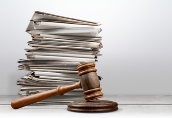 Piles Judicial Court Files And Judge Gavel on the desk