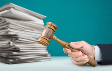 Piles Judicial Court Files And Judge Gavel on the desk