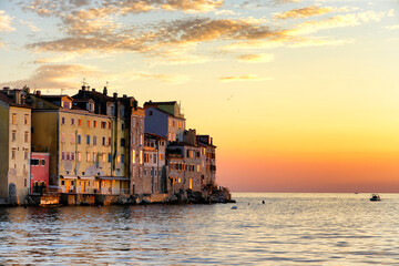 Rovinj colorful houses in vivid gold colors at sunset in Istria, Croatia