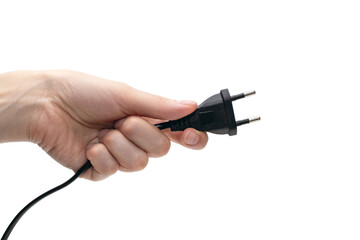 Electric plug for a socket in a hand on a white background. The concept of electricity and its importance in everyday life. Electric plug without a socket in a human hand. Power plug for the device