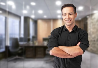 Successful Person. Portrait of confident smiling business man standing in modern coworking office hall, posing