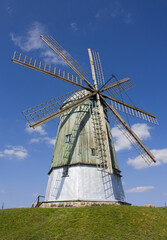Fototapeta na wymiar Dutch windmill in the village of Pustovity, Ukraine
