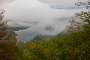 Famous island with old church in the city of Bled. Misty morning with gorgeous lights and colors....
