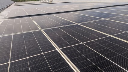 photovoltaic solar panels mounted on building roof for producing clean ecological electricity at sunset. Production of renewable energy concept.