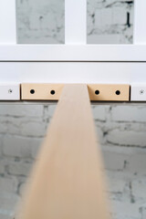 Wooden screed bed. Interior structure of furniture. Vertical photo