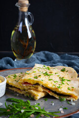 Fried pita bread with scrambled eggs, tomatoes, meat and cheese. Stuffed lavash