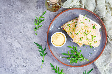 Fried pita bread with scrambled eggs, tomatoes, meat and cheese. Stuffed lavash
