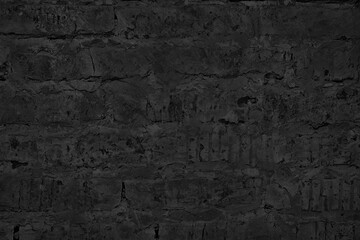 Old rough brick wall black texture. Abstract dark gloomy grunge background