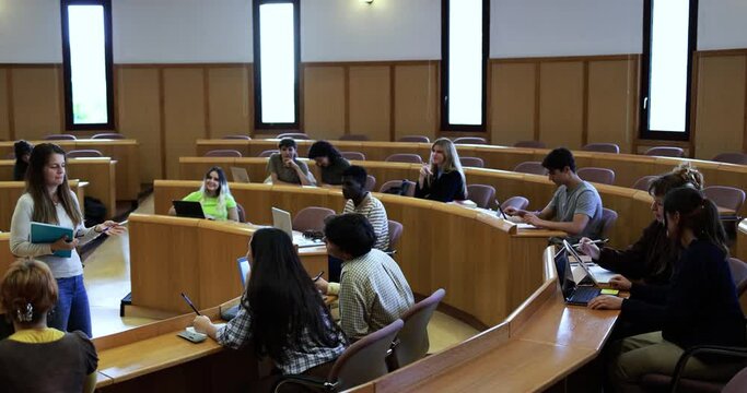 Mature teacher working inside classroom at school university 