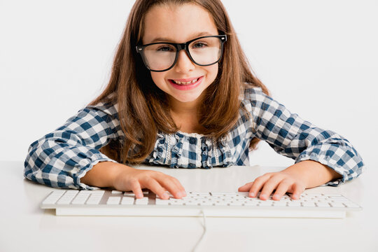 Little girl working with a computer