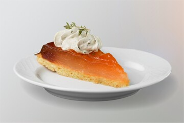 Tasty sweet cake on white ceramic plate. Popular dessert in minimal style