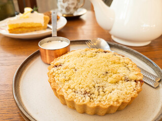 Apple crumble pie and cake with afternoon tea set, homemade bakery.
