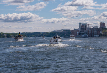 Ferries leaving for the archipelago a cloudy summer day in Stockholm