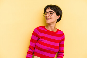 Young caucasian woman with a short hair cut isolated relaxed and happy laughing, neck stretched showing teeth.