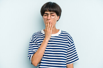 Young caucasian woman with a short hair cut isolated yawning showing a tired gesture covering mouth with hand.