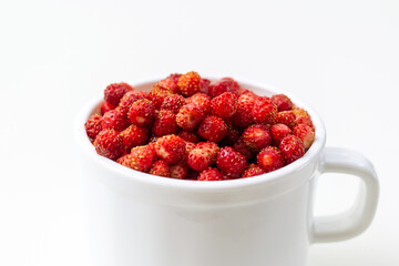 Wild strawberry in a cup.