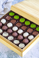 Special chocolate. Packed chocolate on stone background. Truffle chocolate varieties. close up