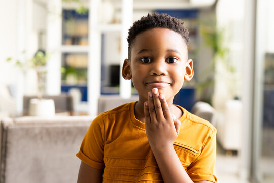 Image Of Smiling African American Boy Using Sign Language