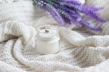 Fototapeta na wymiar Handmade soy wax candle with lavender flowers