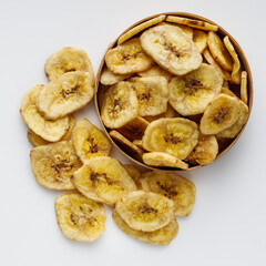 delicious dried banana on a white acrylic background