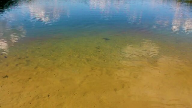 Beautiful quarry lake dredging pond lake blue turquoise water Germany.