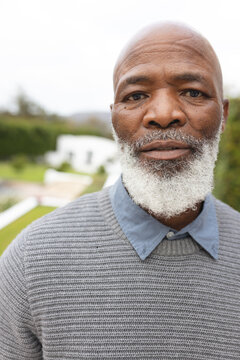 Vertical Image Of African American Senior Man Posing At Camera