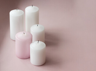 Set of white and pink extinguished candles