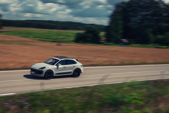 Porsche Macan going fast at the autobahn