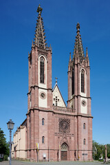 Fototapeta na wymiar Parish church in Geisenheim in Germany, known as Rheingau Cathedral on a clear summer day