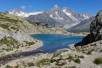 CHAMONIX, FRANCE, July 8, 2022 : The Refuge du Lac Blanc overlooks the Chamonix Valley. It is ideally placed to admire one of the most beautiful mountain ranges in the world. - obrazy, fototapety, plakaty