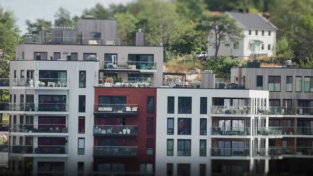 Apartment buildings on the coastline in Kristiansand city.Tilt-shift video.