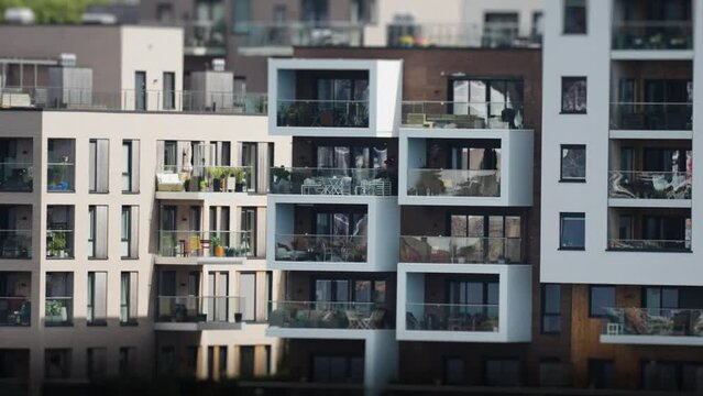 Modern apartment buildings on the coastline in Kristiansand city. Tilt-shift video.