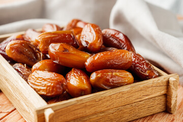 juicy royal dates on a wooden rustic background