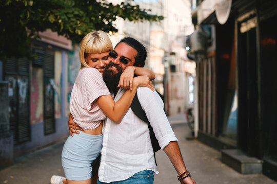Young happy couple embracing on the street
