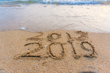 2019 Number on sea beach wave Happy new year concept background