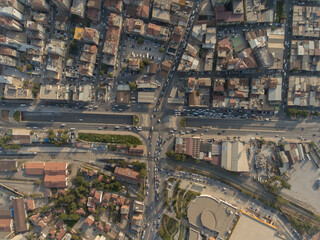 Fototapeta premium Birds eye view of urban life, buildings and crowded streets