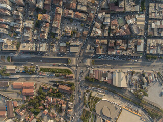 Birds eye view of urban life, buildings and crowded streets