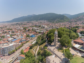 Fototapeta na wymiar Aerial view of Tophane Clock Tower at Bursa, Turkey. The tower currently has a radio clock and is used as a fire lookout station