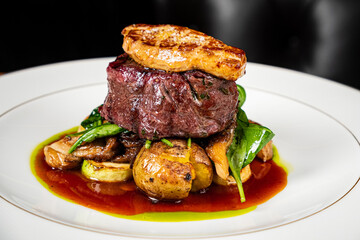 ribeye steak with potato and meat sauce