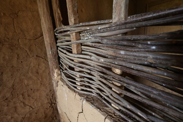 Wicker partition made of twigs in an old house