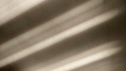 Shadow of a curtains from bamboo on the wall in the afternoon. Light and shadow 