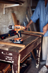 Man assembling furniture and fixing it - hobby concept.