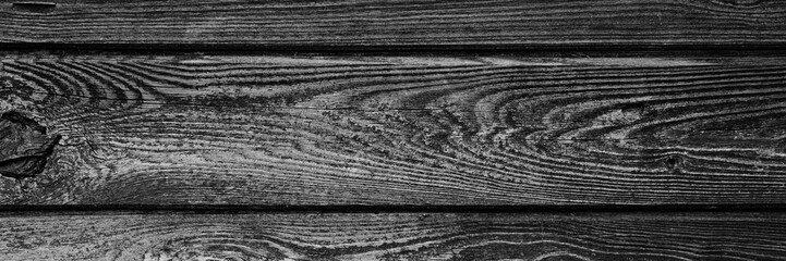 Obraz premium the background is tinted in black and grey colour of old wooden boards. mockup. banner