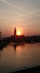 Naklejka premium Stockholm at sunset with a reddish sky - Stockholm bei Sonnenuntergang
