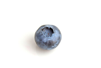 Single blueberry berry isolated on white background. Blueberry with clipping path. Full depth of field.