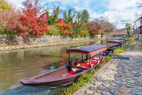 Tourist sightseeing boat in Hachiman-bori canal in Omihachiman, Japan