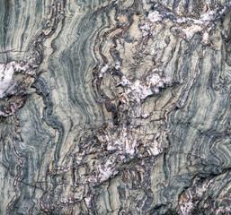 Intricate quartz veins mixed between slate stone